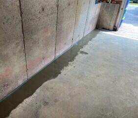 WaterGuard is installed along the perimeter of the basement floor and covered in fresh concrete to provide a seamless finished look. The WaterGuard Port is left visible to provide access to the system when needed.