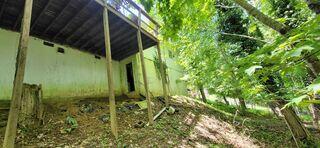 This Boone home shows clear signs of foundation stress. The support posts beneath the deck are leaning on a steep hillside, indicating soil movement and settlement. Over time, this can compromise the stability of the deck and the home's foundation. Push piers will be installed to anchor the structure into stable soil, preventing further shifting and ensuring long-term stability.