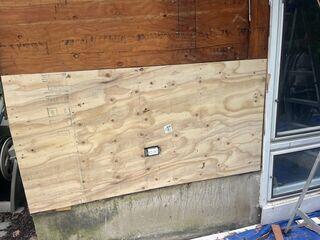 A large section of sheathing is installed.