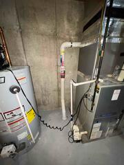 Naugatuck, CT - Discreet Radon Mitigation in a Framing-in-Progress Basement