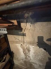 Visible signs of foundation settlement were present in this home, including a prominent interior wall crack. If not properly addressed, such structural movement can compromise the integrity of the foundation over time, potentially leading to more extensive damage, costly repairs, and even partial wall failure. Early intervention is critical to prevent further deterioration and ensure long-term stability.