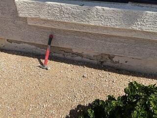 Spalling concrete exposed - late‑stage stem wall failure