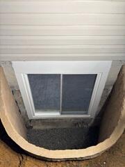 Rockwell Egress Window is installed to provide the homeowner an emergency exit while providing the basement with light.