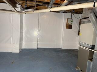 CleanSpace was installed on the walls to keep the moisture and humidity from the walls from filtering into the basement and weakening the supports and creating an unstable environment.
