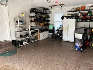 We'll be able to prove to you that this garage foundation was sloping down near the right side of this picture in the next photo slide. Take a peek at the fridge, and then scroll to the next photo.