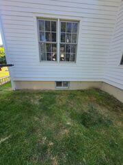 The before photo of old basement windows in Kinderhook, NY. These do not allow for a safe exit incase of emergency.