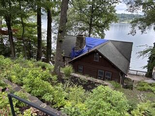 Here's a look at Mary Ann's roof before the renovation. That tarp has got to go! Swipe through to see the expert transformation!