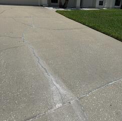 The homeowner's concrete driveway had cracked and become uneven due to the settlement of the underlying soil.