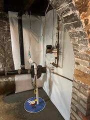 SuperSump was installed in the corner of the basement to pump out floodwater out of the house and away from the home's foundation.