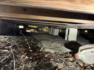 Upon inspection of the homeowner's crawl space by the LRE Design Specialist, it was discovered that many of the block piers supporting the floor joists had settled into the soil below.
