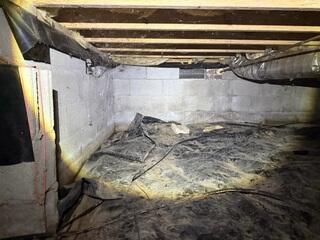Moisture, mold and falling, failing insulation are problems in this crawl space, which hasn't been properly sealed. The encapsulation treatment totally separates and protects the crawl space interior from outdoor conditions, keeping the space clean and dry.