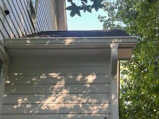 Side of home after gutter installation