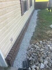 Installed along the base of foundation walls to collect and channel water away, preventing seepage and protecting the structure.