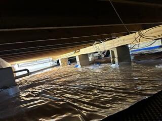 Laying Down Vapor Barrier