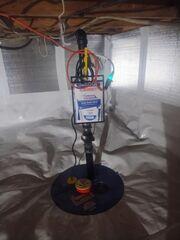 SuperSump, a premier sump pump system, is safely installed into our crawl space encapsulation system.