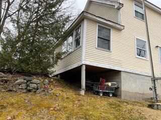 The original footings beneath the home began to settle over time, compromising the structural stability of the foundation. As a result, the wooden support posts were no longer capable of adequately bearing the load of the structure above, increasing the risk of floor deflection and long-term damage.