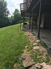 The part of the deck that was most problematic was the sunroom addition. The sunroom is up on the deck and is enclosed with vinyl siding. It's likely that the support posts underneath the sunroom weren't capable of holding all the weight due to problematic soil underneath their concrete foundations.