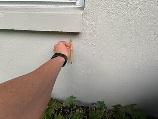 Small hairline cracks had appeared in the exterior walls of the home, an early sign that the foundation was settling.