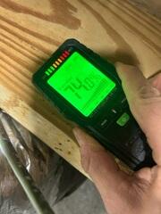 Checking the levels of humidity in the crawl space. This level is too high; it is a breeding ground for mold and wood rot, leading to structural damage.