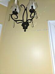 The customer's wall cracked due to foundation settlement, which occurs when the home's foundation shifts or sinks because of unstable soil. This movement creates stress on the structure, causing the walls to shift and drywall to crack as a result.