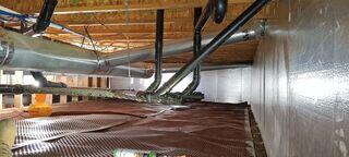 The crawl space with drainage matting and SilverGlo©