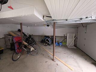 The existing lally columns beneath the garage were structurally inadequate to support the load of the floors above, resulting in noticeable floor deflection and bounce. This lack of proper support led to gradual sinking, compromising both comfort and structural integrity.
