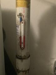 The U-tube manometer on the existing radon mitigation system displayed equal pressure levels on both sides, indicating that the radon fan was not generating sufficient suction at the extraction point. This lack of differential pressure suggests the system is not actively drawing radon from beneath the home, thereby increasing the risk of radon exposure. Under normal operating conditions, the manometer should show a noticeable pressure difference-typically with one column higher than the other-demonstrating that the fan is effectively pulling radon-laden air from the sub-slab area and venting...