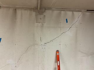 Large crack compromising the foundations integrity.