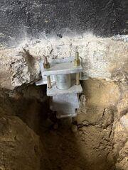 Push Piers Secured to Footing