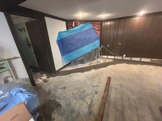 The WaterGuard™ function is to collect and move excess water that's seeping out from the floors/wall joints. Under the grey lines, in this photo, is where the WaterGuard™ is installed.