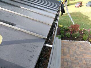 Removing debris from gutters