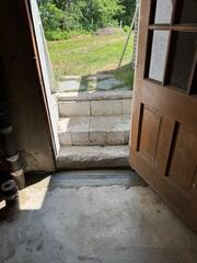 Radon Sealed Surface Drainage in Front of Doorway Entrance