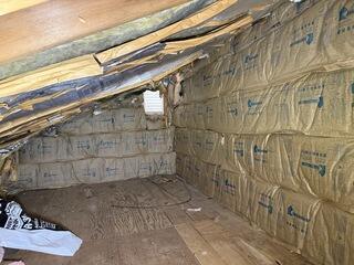 Knauf rolled insulation was installed to the walls in order to reflect heat back into the knee walls.