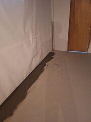 The WaterGuard™ system will collect the excess water from this wall/floor joint.