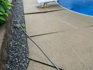 Over time, sections of the pool deck experienced differential settlement due to underlying soil voids, resulting in uneven surfaces and hazardous trip points that rendered the area nearly unusable. To restore structural integrity and safety, it was necessary to fill these voids and reestablish uniform support beneath the concrete slabs, thereby stabilizing the pool deck and preventing further displacement.