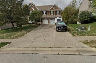 This is what the driveway looked like from the street before we started.