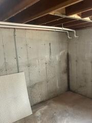 Here are the installed discharge lines, which will transport the collected water away from the basement.