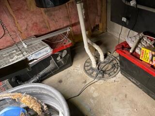 The absence of a basement drainage system, combined with an unreliable sump pump, left the finished basement vulnerable to water intrusion. Without proper water management infrastructure in place, hydrostatic pressure and groundwater infiltration posed a significant risk to the integrity of the space.