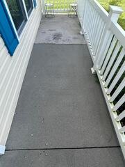 The concrete porch on this home was covered in grime.