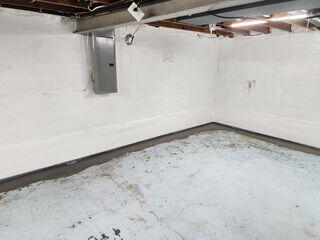 Our WaterGuard subfloor drains sit just below the floor slab to stay clear of mud. In fact, they come with a little wall flange that barely peeks out from the floor. This allows our drains to capture moisture that may seep down from the walls.