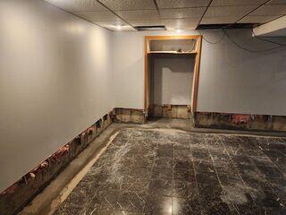 We had to cut a foot of the drywall out up from the basement floor to install our drainage system. The homeowner was well aware of this, and knew that it was worth it to ensure their basement stays dry forever.