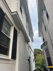 Chimney damage and worn shingles