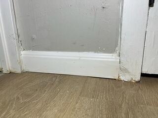 Water seepage from the walls had caused the drywall and trim to discolor and rot.
