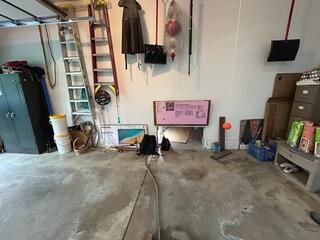 The crew accessed this wet crawl space through the garage.