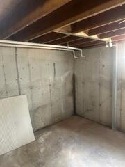 The discharge lines are designed to transport and drain the collected water away from the basement's foundation.