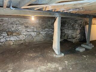 Deteriorating Fieldstone Foundation Wall