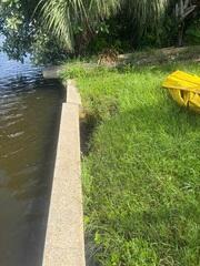 Large voids had developed behind the homeowner's seawall as the soil had eroded over time, creating a lack of sturdy support.