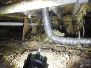 Damp and Debris-Filled Crawl Space
