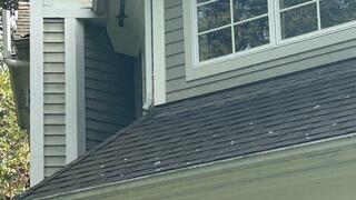Notice the downspout draining directly onto the lower roof? That constant water flow causes staining, lichen growth, and long-term shingle damage. Definitely not ideal, and time to reroute it the right way.