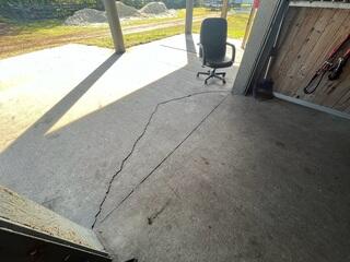 Rodents had created large voids beneath the horse stable, causing the concrete slabs to settle and develop significant cracks across the surface.